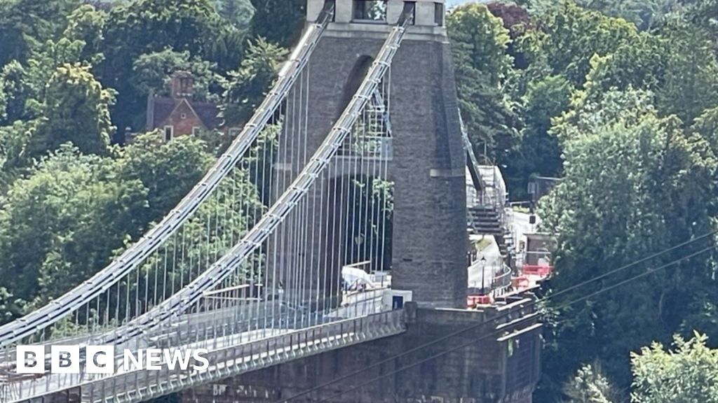 Manhunt launched after remains found in suitcases near bridge