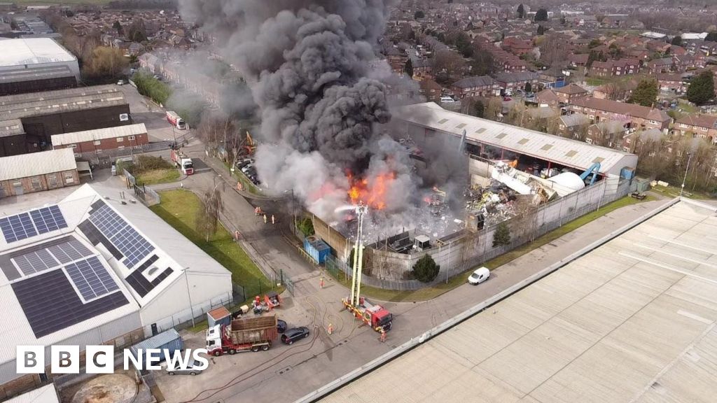 Fire crews tackle scrapyard blaze near retail park