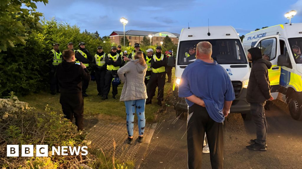 Two arrests and three police officers injured in protest at 