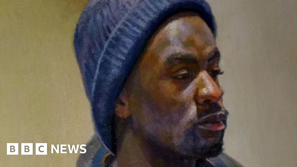 Artist overcomes 'racism' to show black portraits