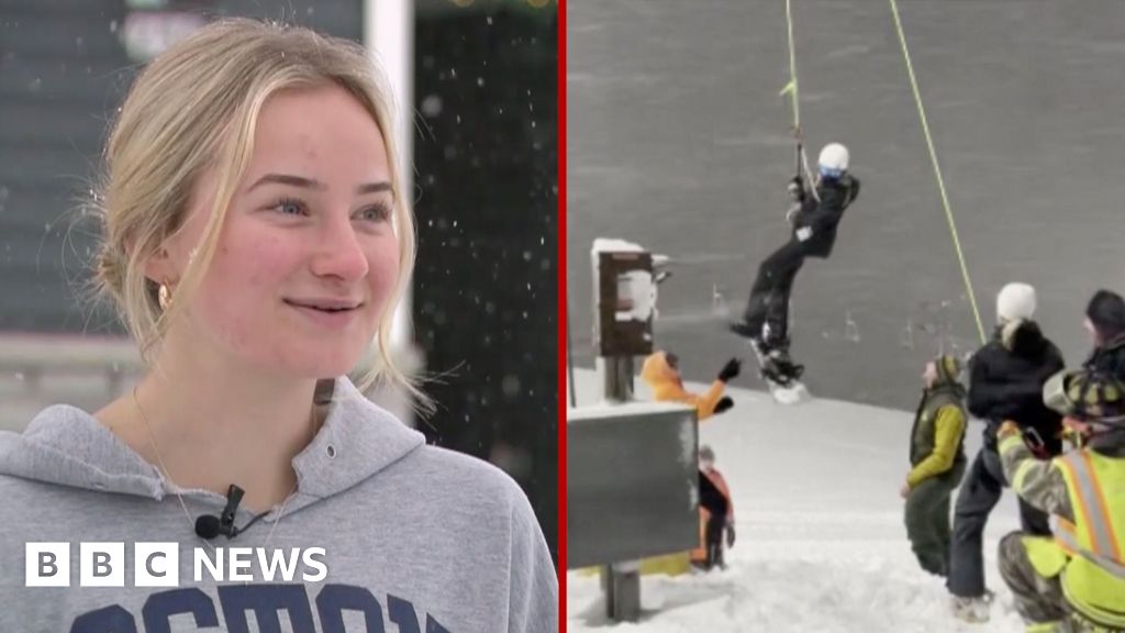 Watch: Moment snowboarder is rescued from stuck chairlift
