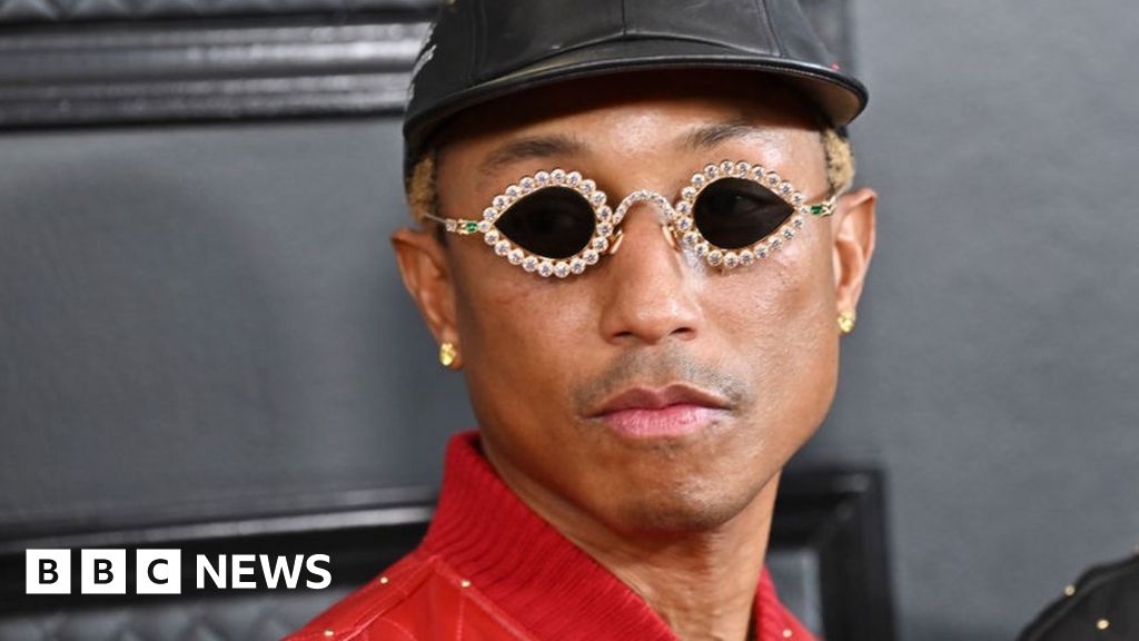 Pharrell Williams in Chanel and Adidas During Paris Fashion Week