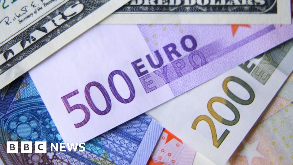 Euro falls below dollar for first time since 2002