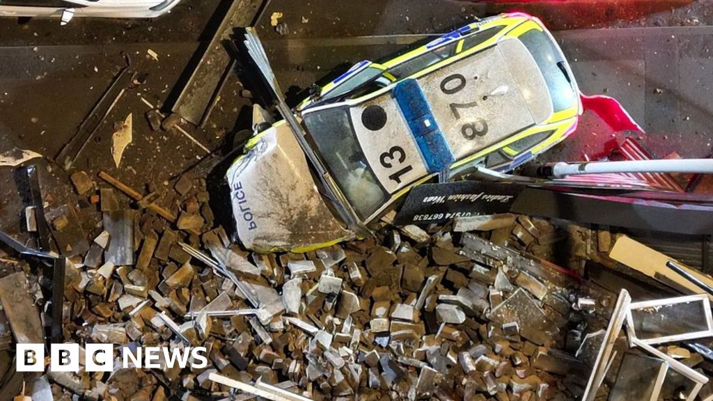 Bradford police car crash causes damage to row of buildings BBC News