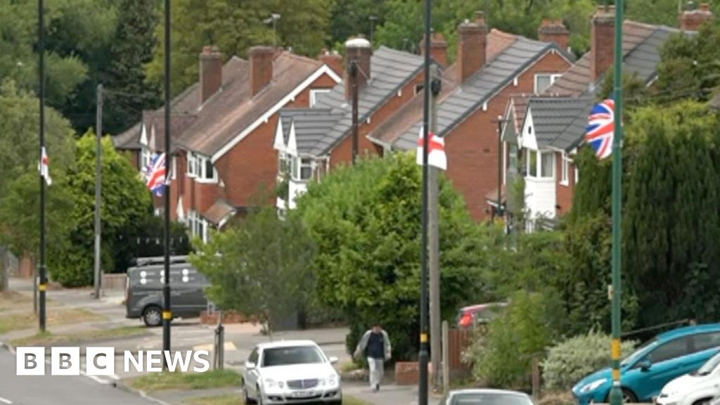 England flags hung by locals taken down