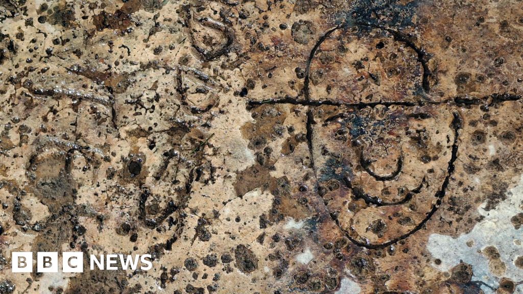 Intriguing slogan, names and cartoon found carved into WW2 defences