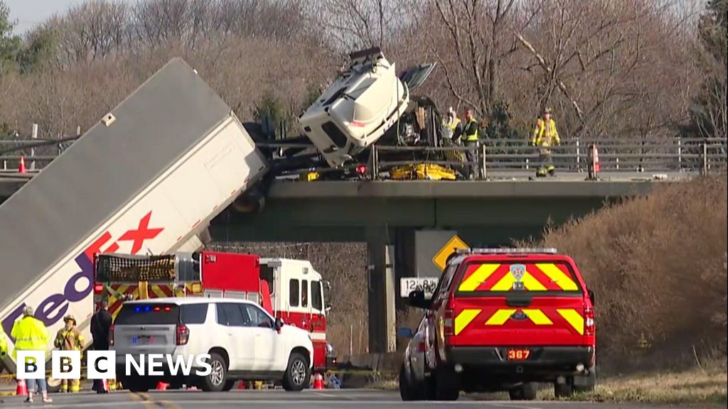 FedEx truck hangs from bridge in New York state