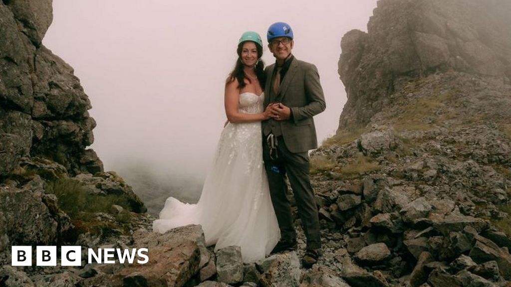 Newly-weds scale Skye peak in wedding outfits