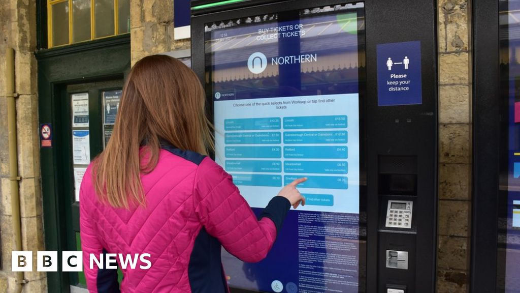 Woman at Northern ticket machine