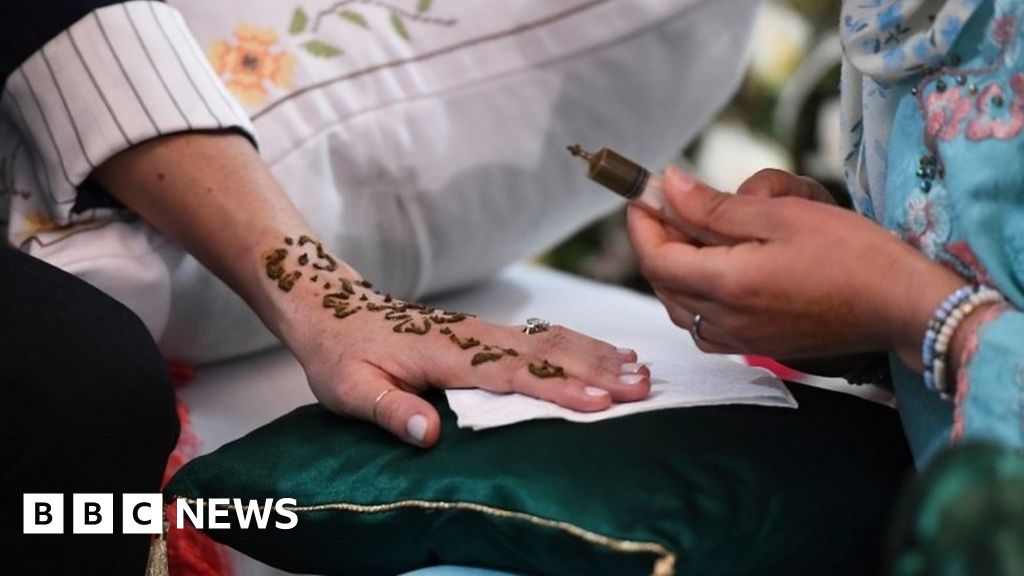 Woman Hand with black henna tattoo on jewelry, Indian bride girl hand with  black mehndi tattoo Stock Photo - Alamy