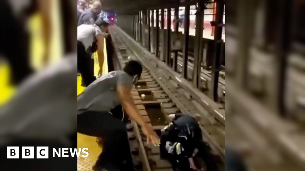 New York officer rescues fallen man from subway train