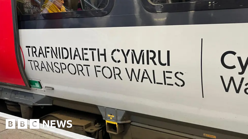 Train hits tractor on level crossing