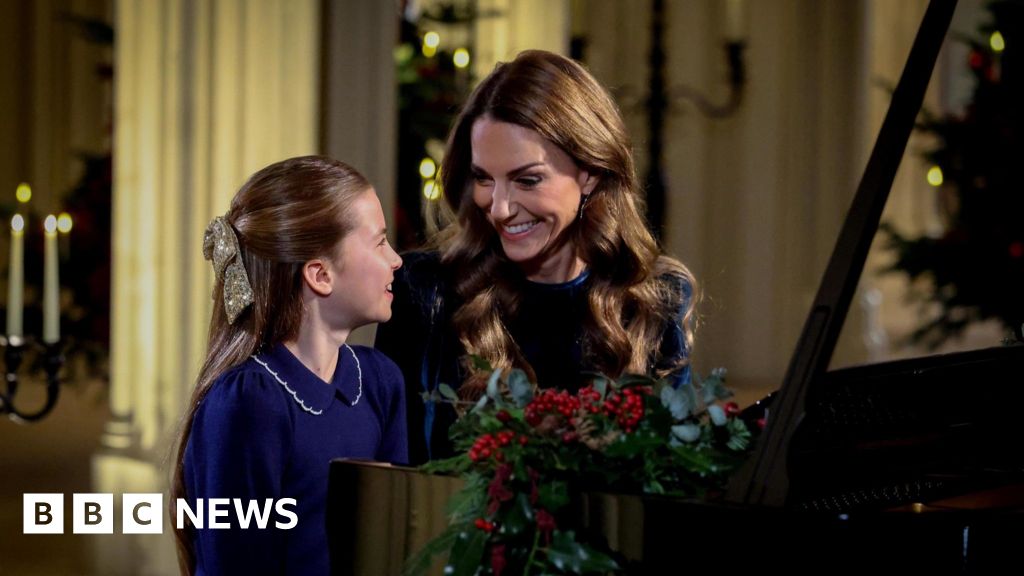 Catherine and Charlotte perform piano duet for Christmas carol concert