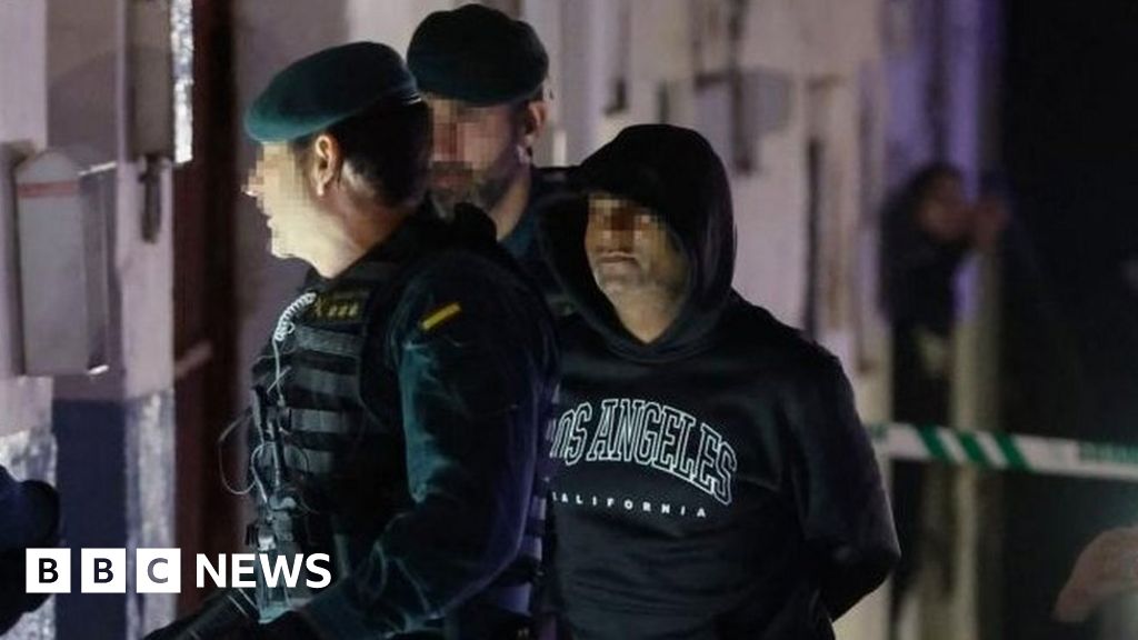 Spain triple murder suspect held for prison killing