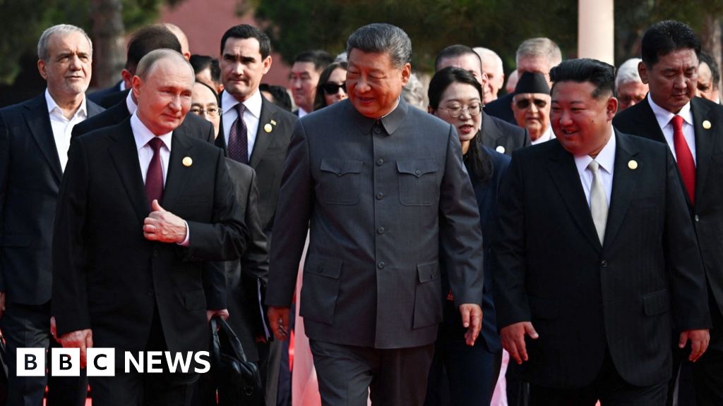 Moment Xi, Putin and Kim pose with world leaders at Chinas military parade