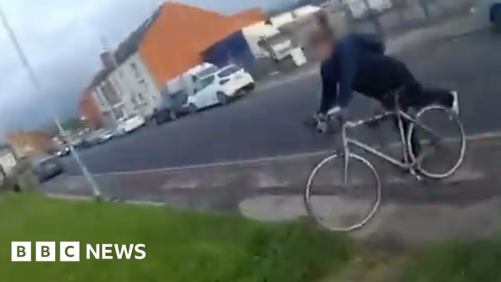 Image for article: Police officer borrows passer-by's bike to chase down suspect Image