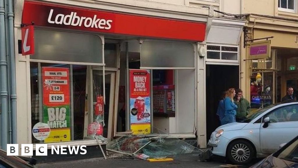 Bookmakers and showroom damaged in car crashes