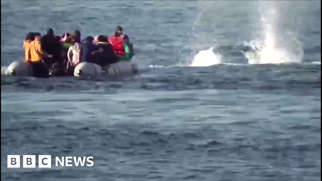 Greek coast guards fire into sea near migrant boat