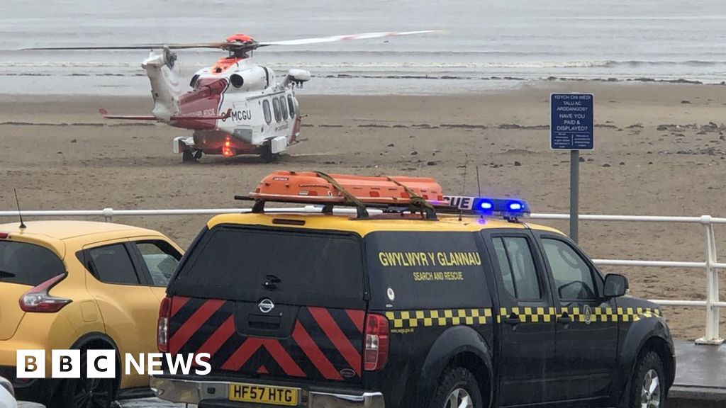 Man rescued from sea after 'falling from pier'