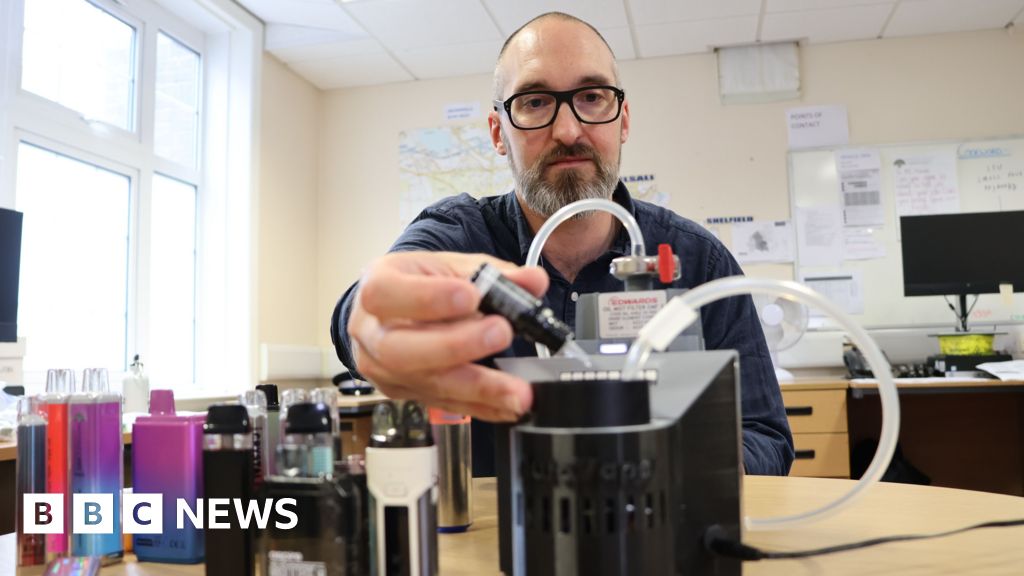Prof Chris Pudney using scientific equipment