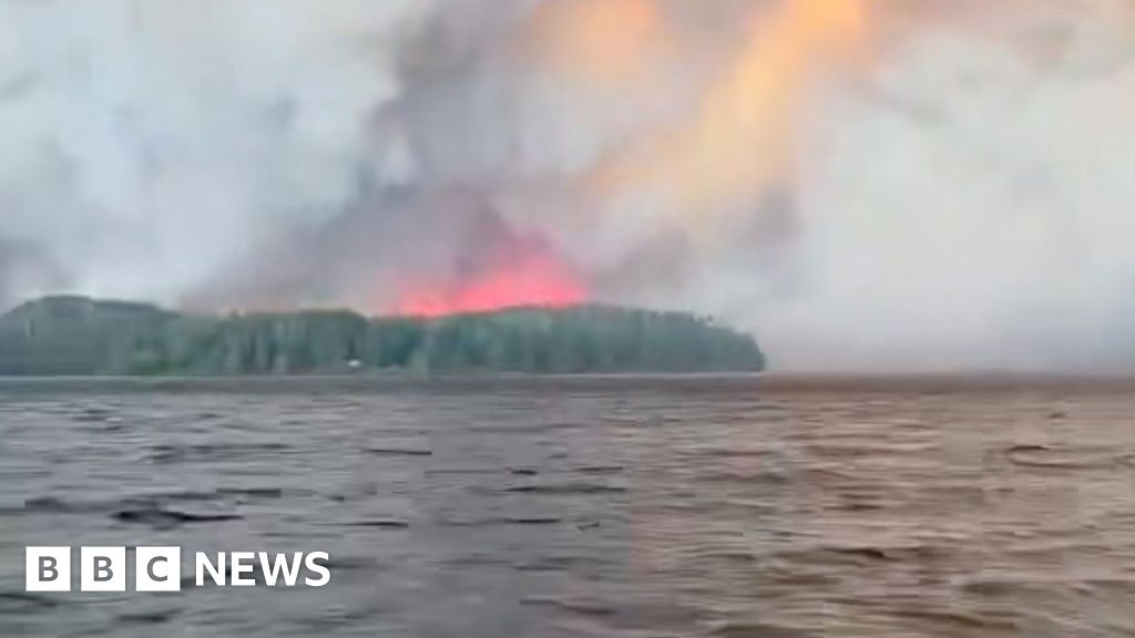 Residents flee massive Canadian wildfire by boat  www.bbc.com