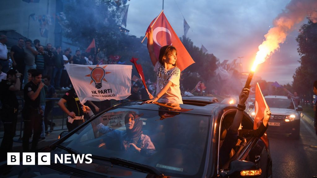 Supporters celebrate outside the AK party headquarters on June 24, 2018 in Istanbul, Turkey