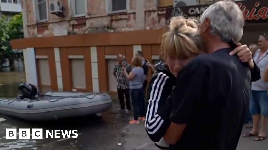 Ukraine dam breach: Tears and a hug as people rescued