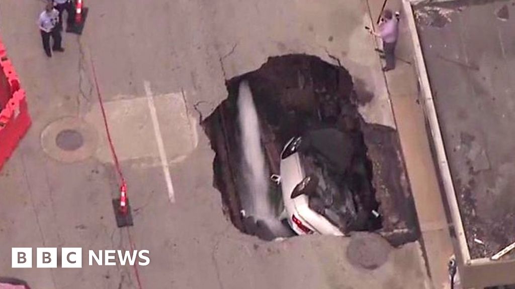 Sinkhole Swallows Car In St Louis Bbc News 5856