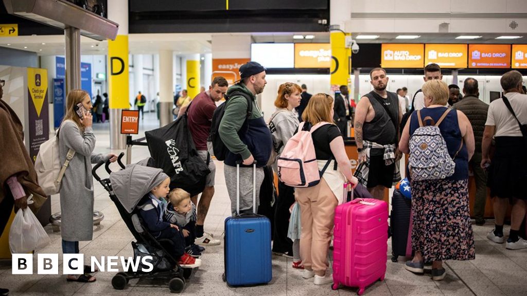 People queuing at Gatwick Airport