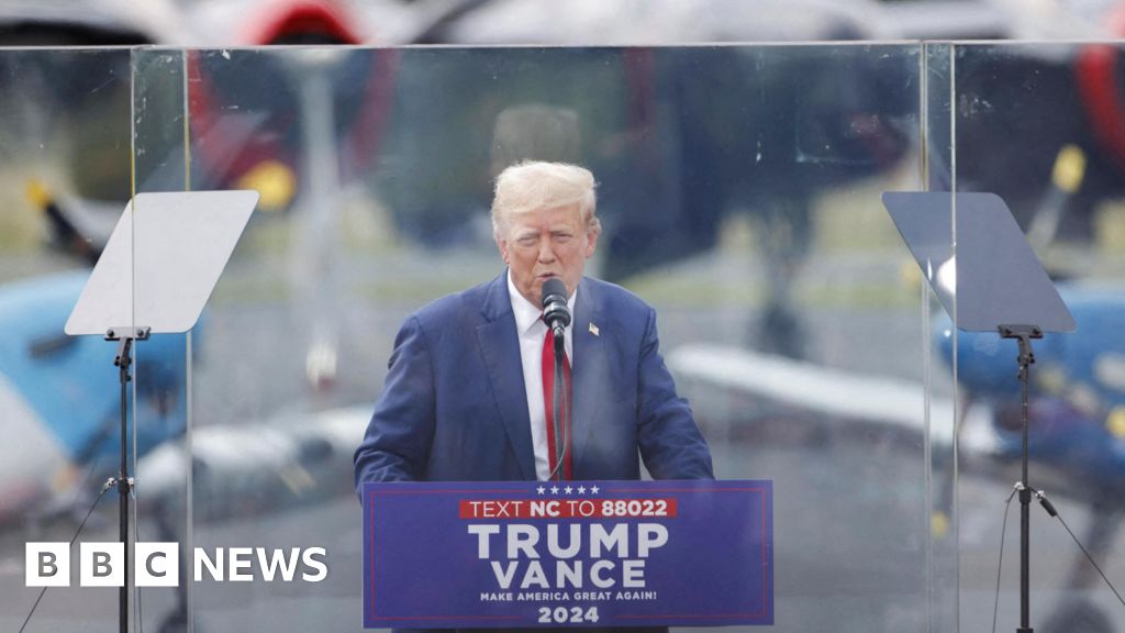 Watch: Trump speaks behind bullet-proof glass at rally