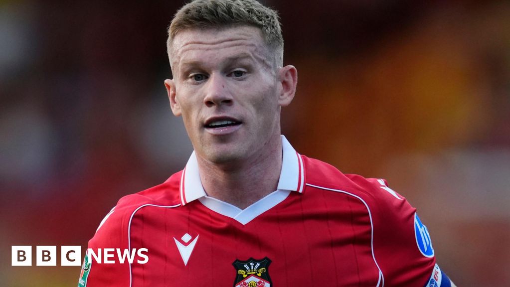 Wrexham star punches rival fan in car park