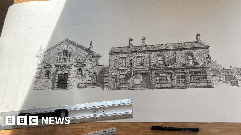 Artist recreating Lincoln street on giant roll of paper