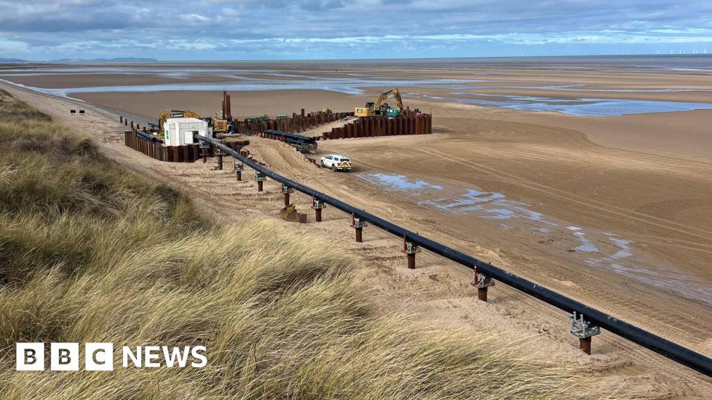 bbc.co.uk - Amelia Shone-Adams - Talacre beach giant pipe across sand shocks visitors