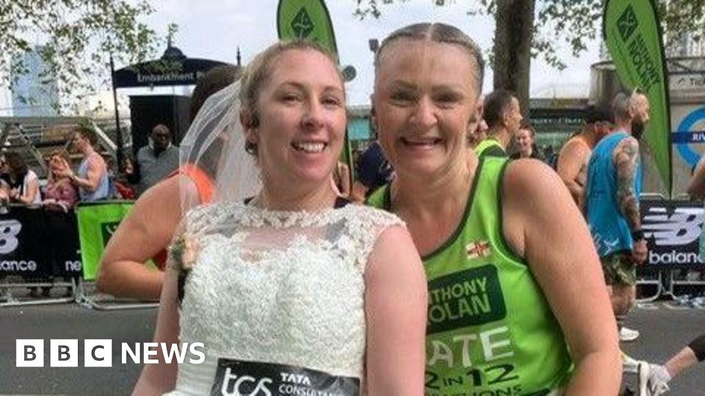 Widow completes anniversary marathon while wearing wedding dress