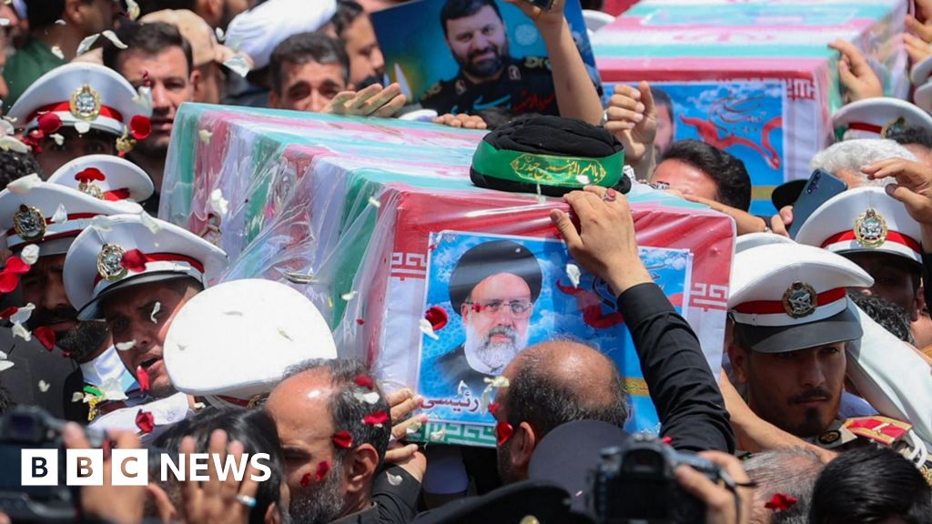 Iran burying late president at shrine in home city of Mashhad