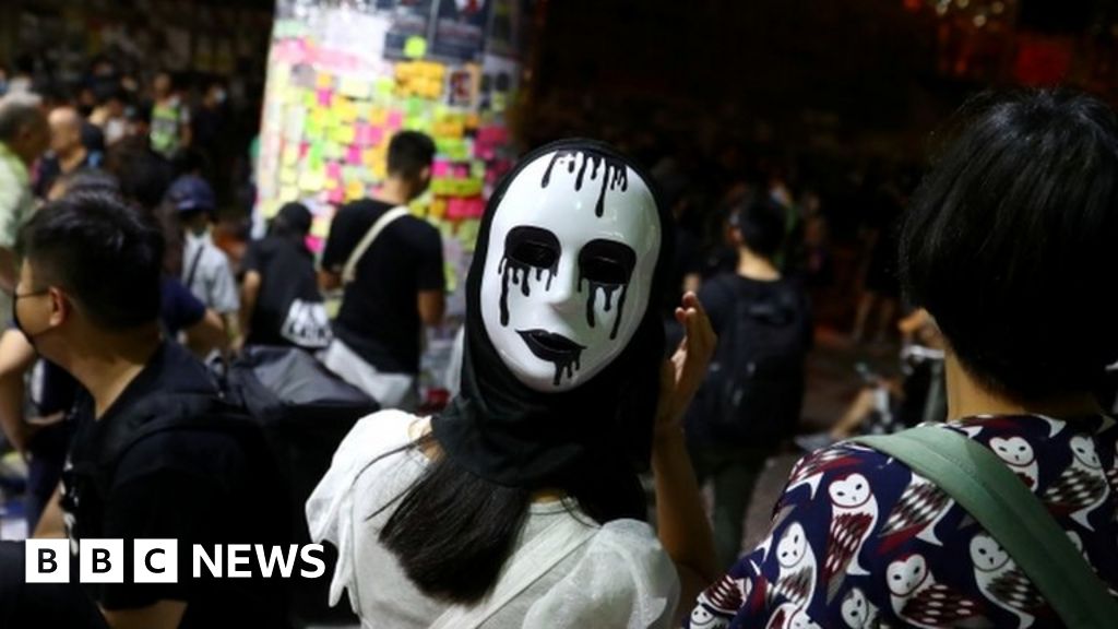 Hong Kong: Face Mask Ban Prompts Thousands To Protest - BBC News