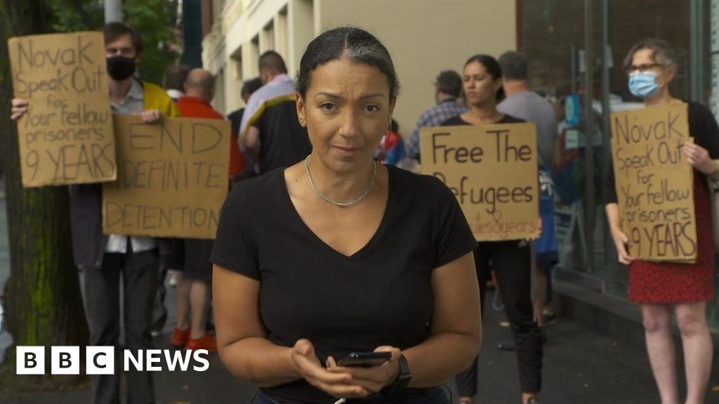 Outside the hotel where Novak Djokovic is detained