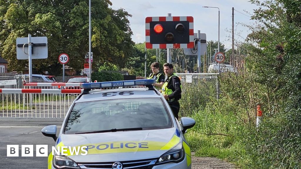 Nottinghamshire Police officer hit by train while helping man