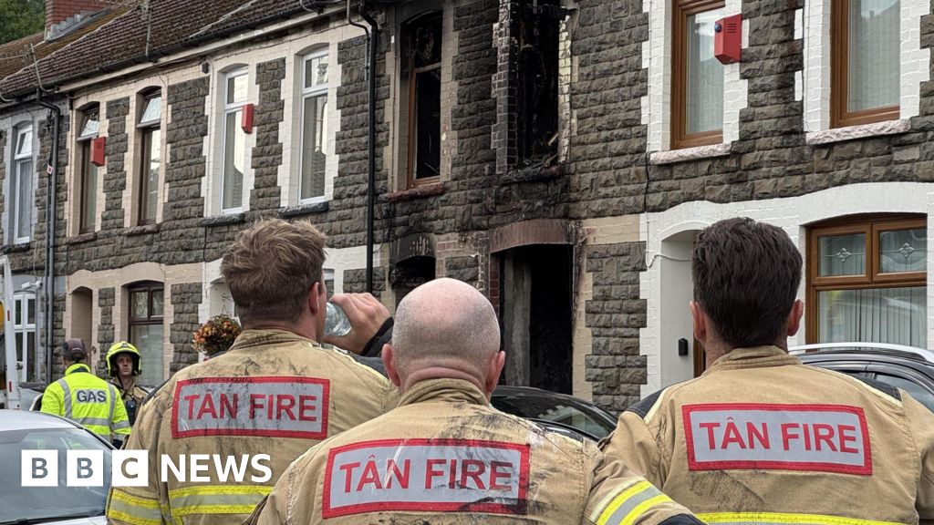 Four charged after house fire on terraced row