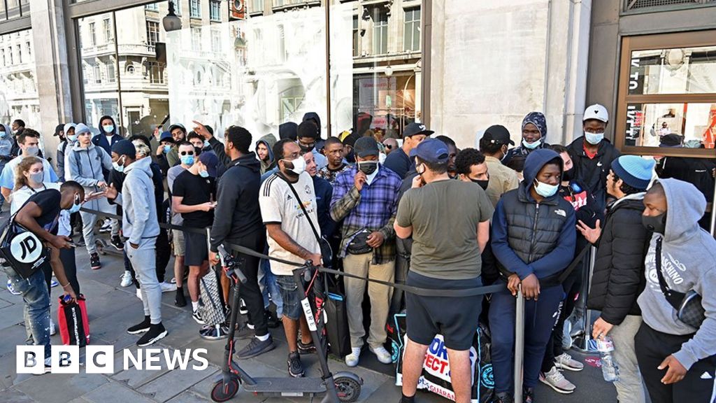 Queues and social distancing as shops reopen in England thumbnail