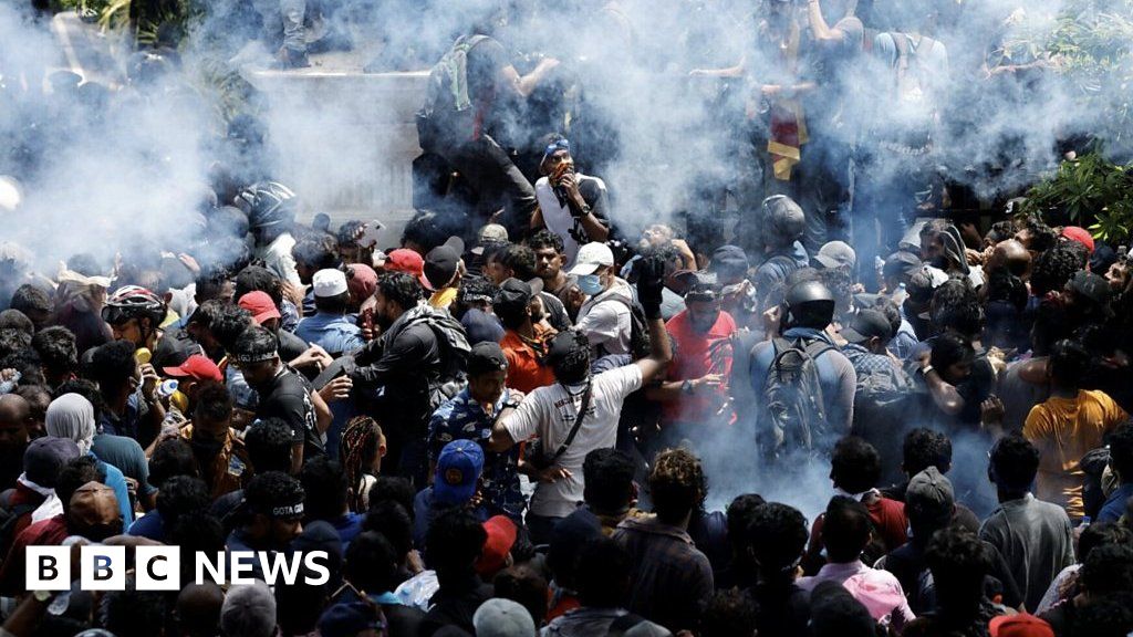 Crowds tear down gates and climb walls in Sri Lanka