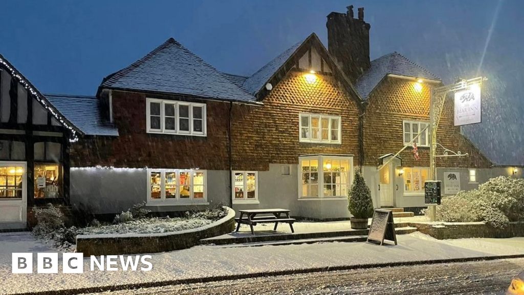 UK weather: Dozens take refuge in pub amid heavy snowfall