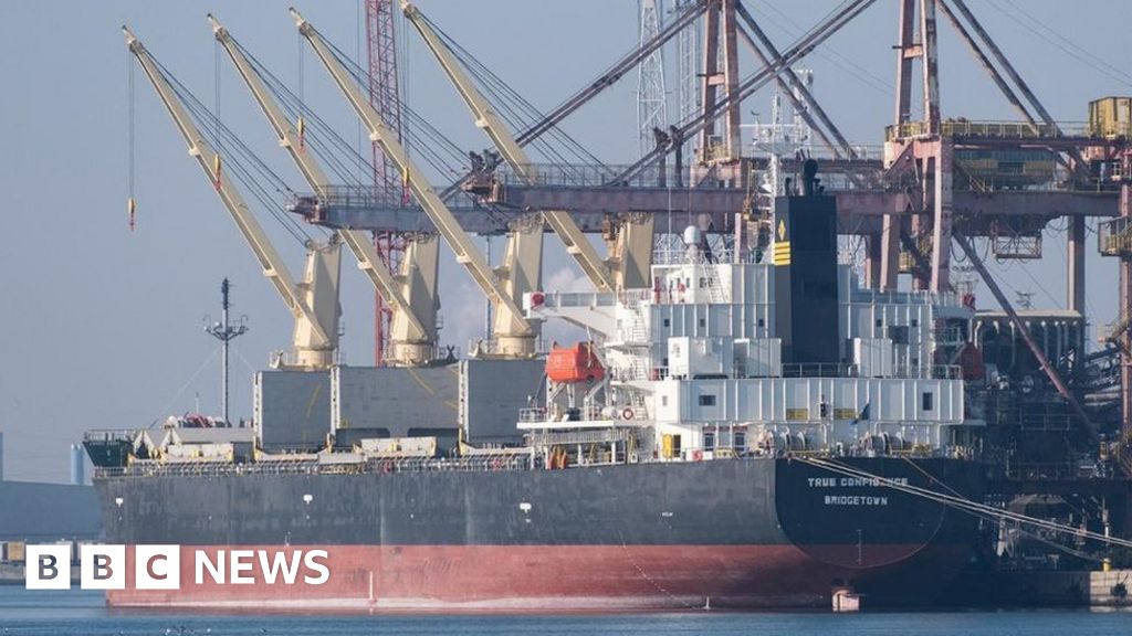 The ship's crew abandons a cargo ship hit by a missile off Yemen