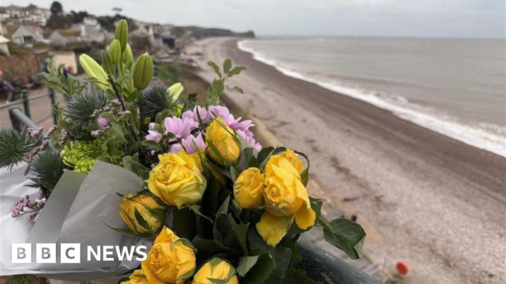 Search for two men missing after Christmas Day swim called off - BBC News