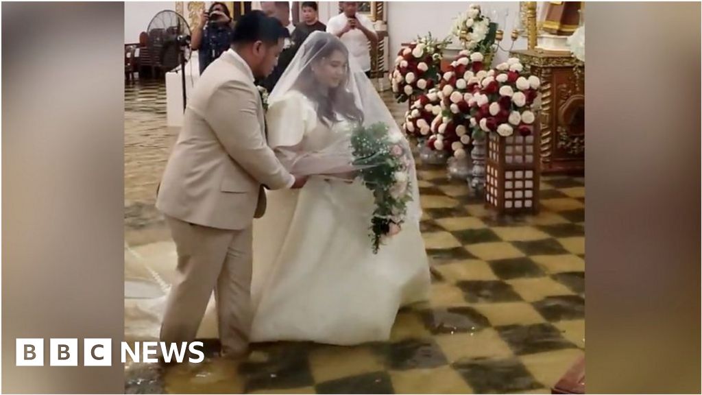 Watch: Bride walks down flooded aisle after typhoon