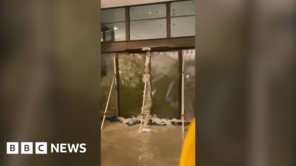 Watch: Moment water shatters glass doors of Hong Kong hotel