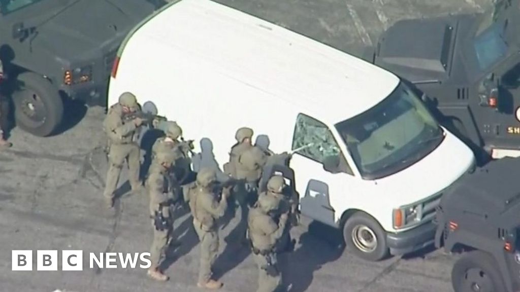 Monterey Park shooting: Armed police enter white van