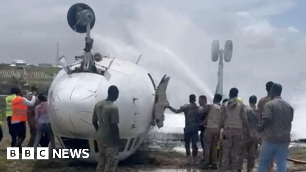 Somalia plane crash: Plane flips over at Mogadishu airport