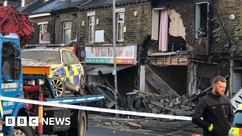 Bradford police car crash causes damage to row of buildings