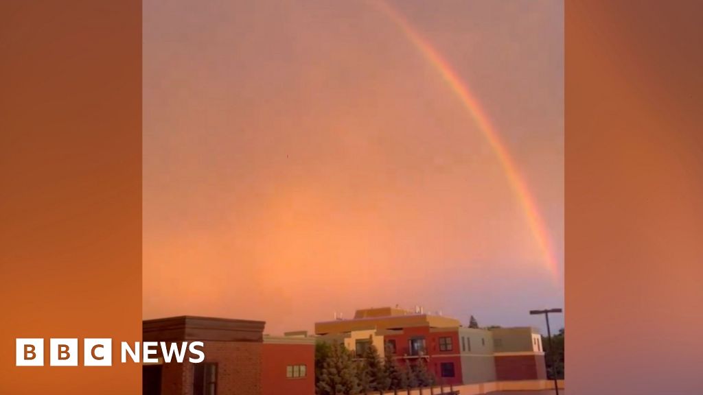 Lightning strikes and a rainbow forms during Minnesota storm